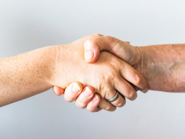 person holding hands of another person