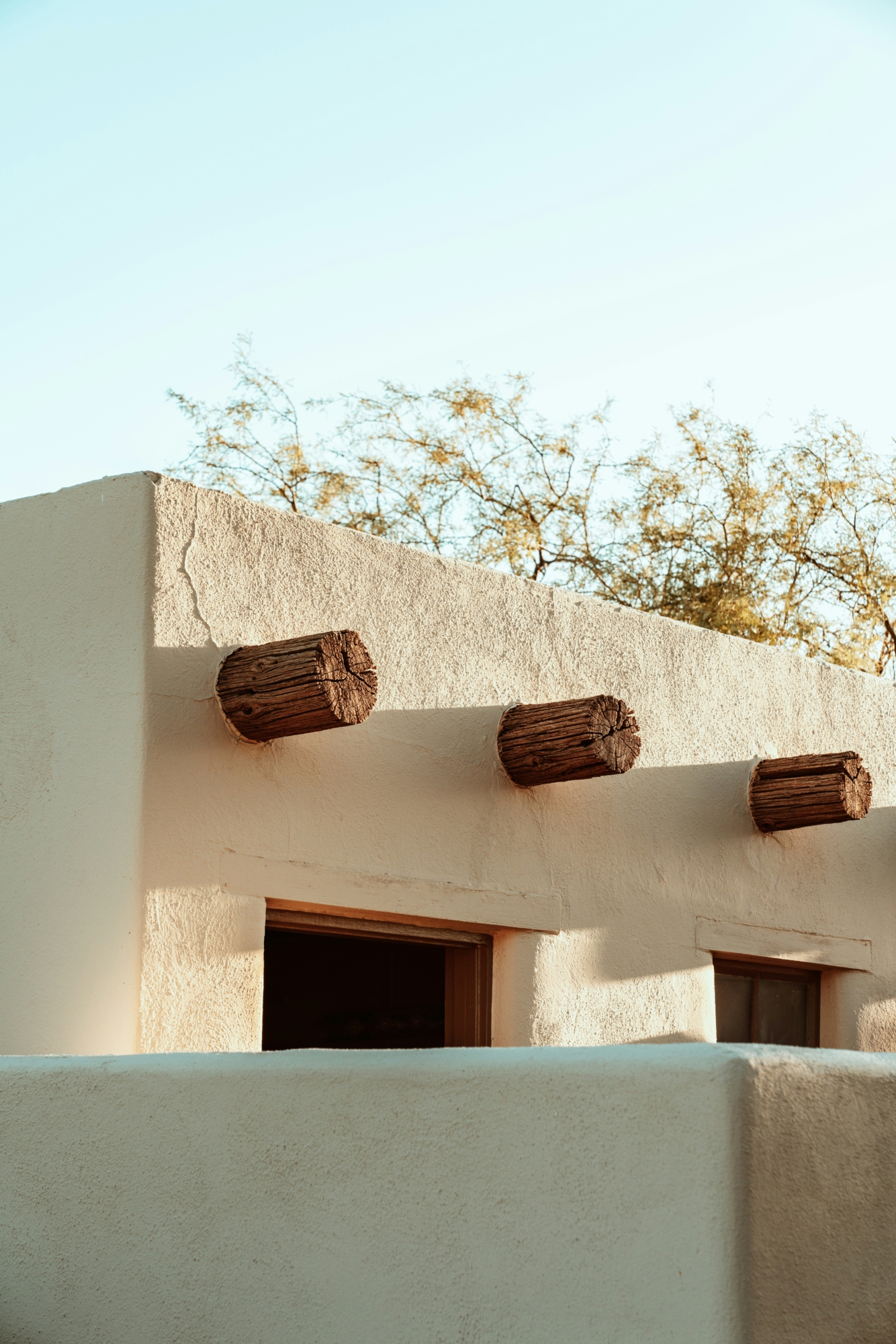 Exterior building structure of an adobe desert house.